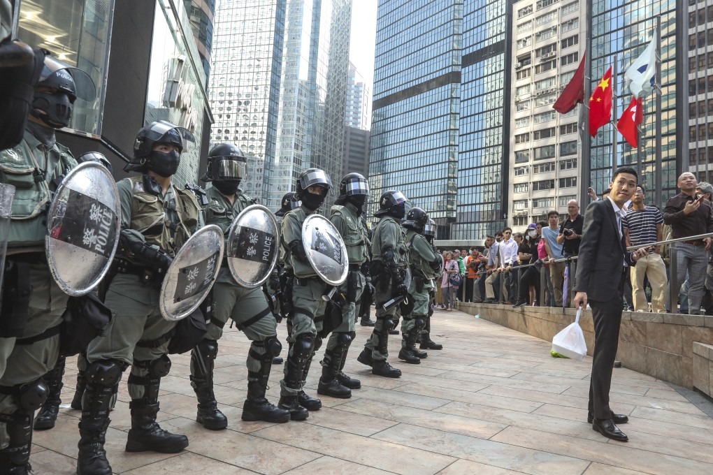 Riot police form a line near an anti-government rally in Central on November 13, 2019. Photo: Nora Tam