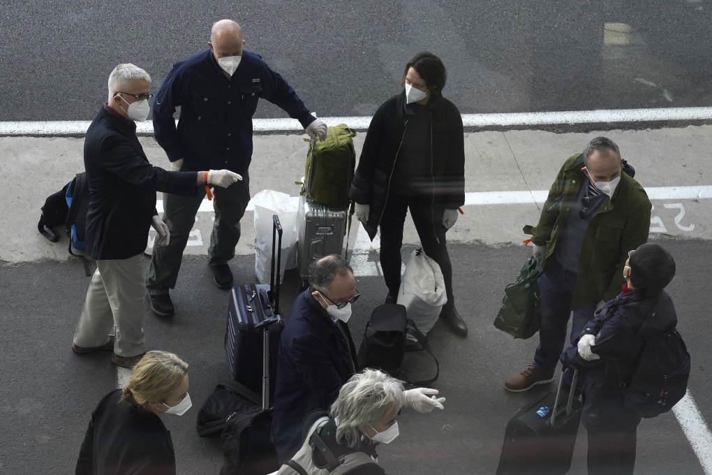 Members of a WHO team arrive in Wuhan in central China's Hubei province on Thursday. Photo: AP