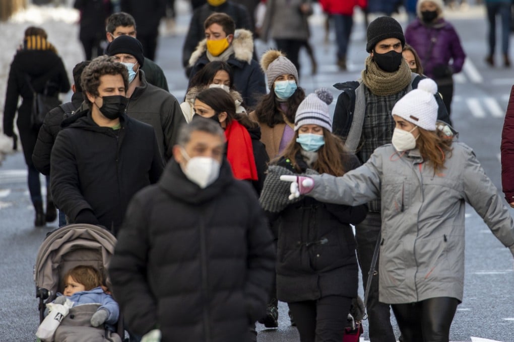 People walk through Gran Via avenue in downtown Madrid, Spain. File photo: AP