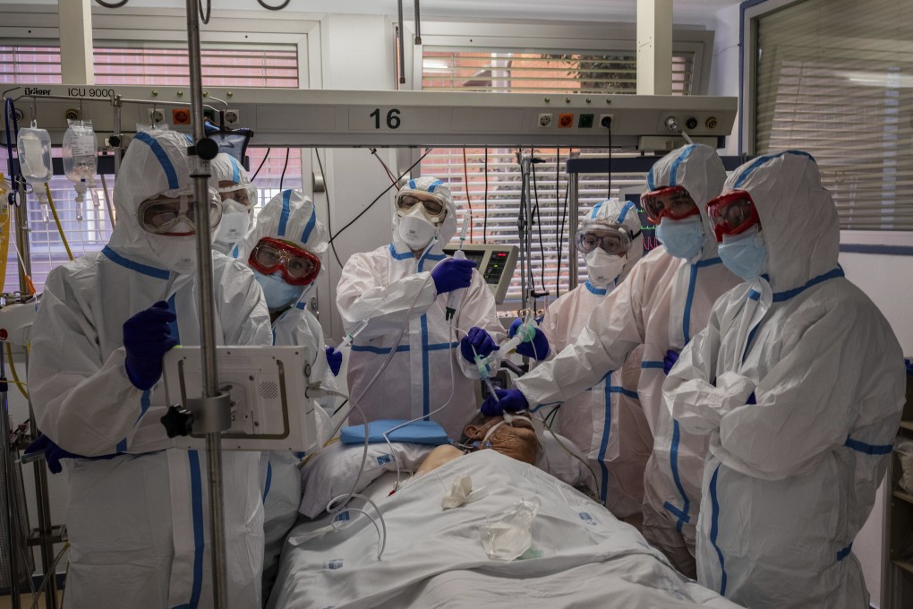 A patient infected with Covid-19 is treated at the Severo Ochoa hospital in Leganes, near Madrid, Spain. Photo: AP