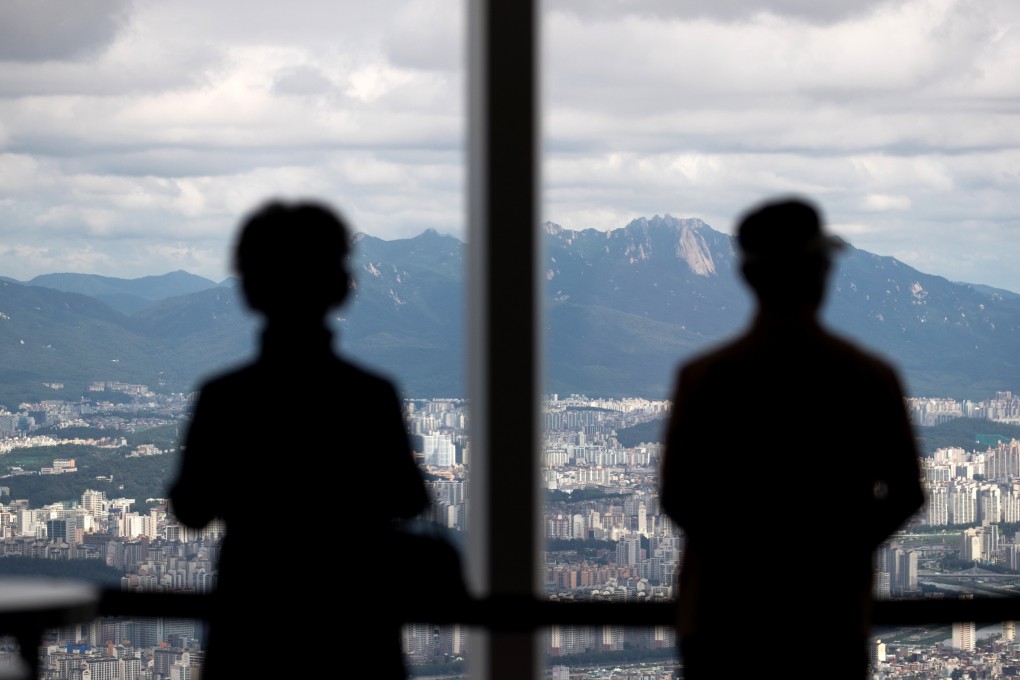 Visitors look out from the Seoul Sky observation deck. South Korea must find ways to negotiate survival in a world upended by a pandemic, an emboldened Beijing and a new US administration coming to power. Photo: Bloomberg
