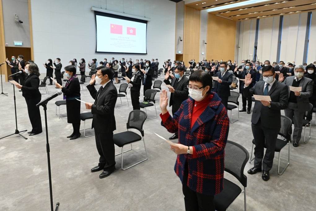 Hong Kong civil servants take their oath of allegiance to the Hong Kong SAR and the People’s Republic of China, on December 18. Photo: Handout