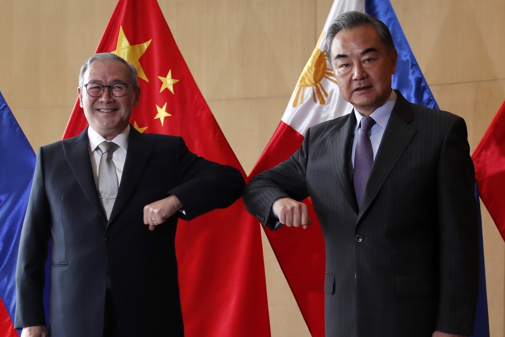 Philippine Foreign Affairs Secretary Teodoro Locsin Jnr with Chinese Foreign Minister Wang Yi in Manila. Photo: AP
