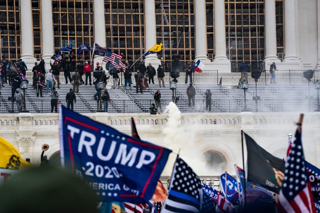 Supporters of US President Donald Trump clash with the US Capitol police during a riot at the US Capitol on January 6, in Washington. Photo: TNS