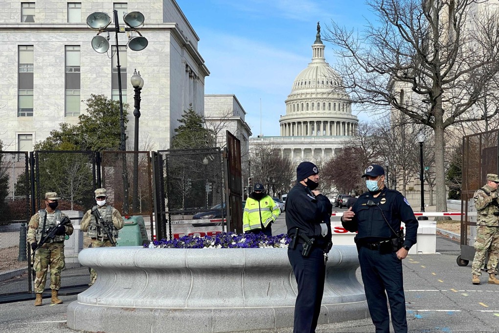Members of the US National Guard and police officers patrol near the US Capitol in Washington, DC on Saturday. Photo: AFP