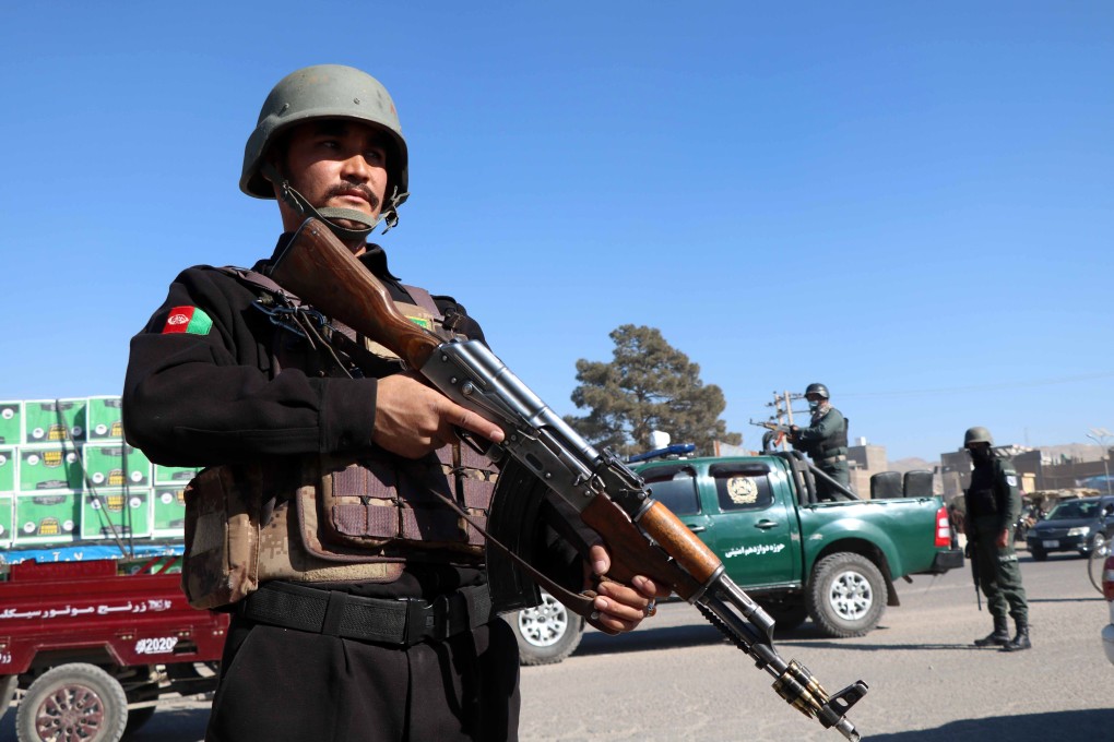 A security official stands guard on a road side check point in Afghanistan. Photo: EPA-EFE