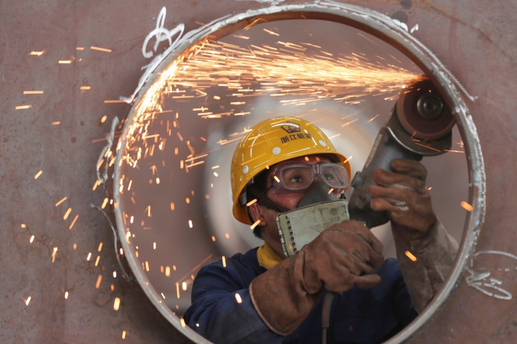 An employee works on a production line manufacturing steel structures in a factory in Huzhou, Zhejiang province, in May last year. China’s economy grew by 2.3 per cent in 2020, in a dramatic turnaround since the coronavirus pandemic ravaged the country in the early part of the year. Photo: Reuters