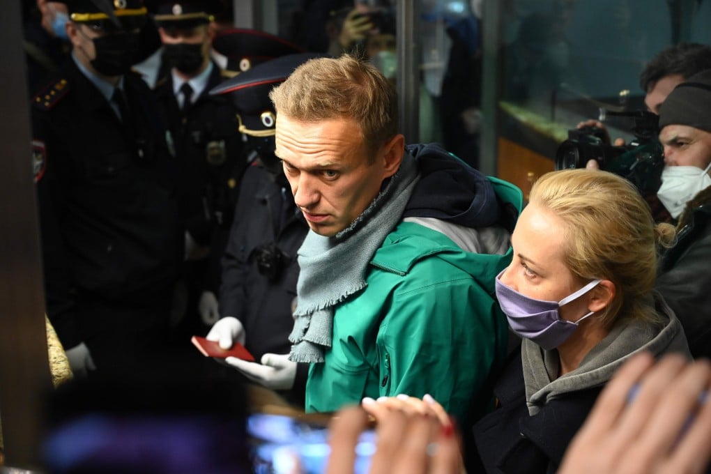 Russian opposition leader Alexei Navalny and his wife Yulia are seen at the passport control point at Moscow's Sheremetyevo airport on Sunday. Photo: AFP