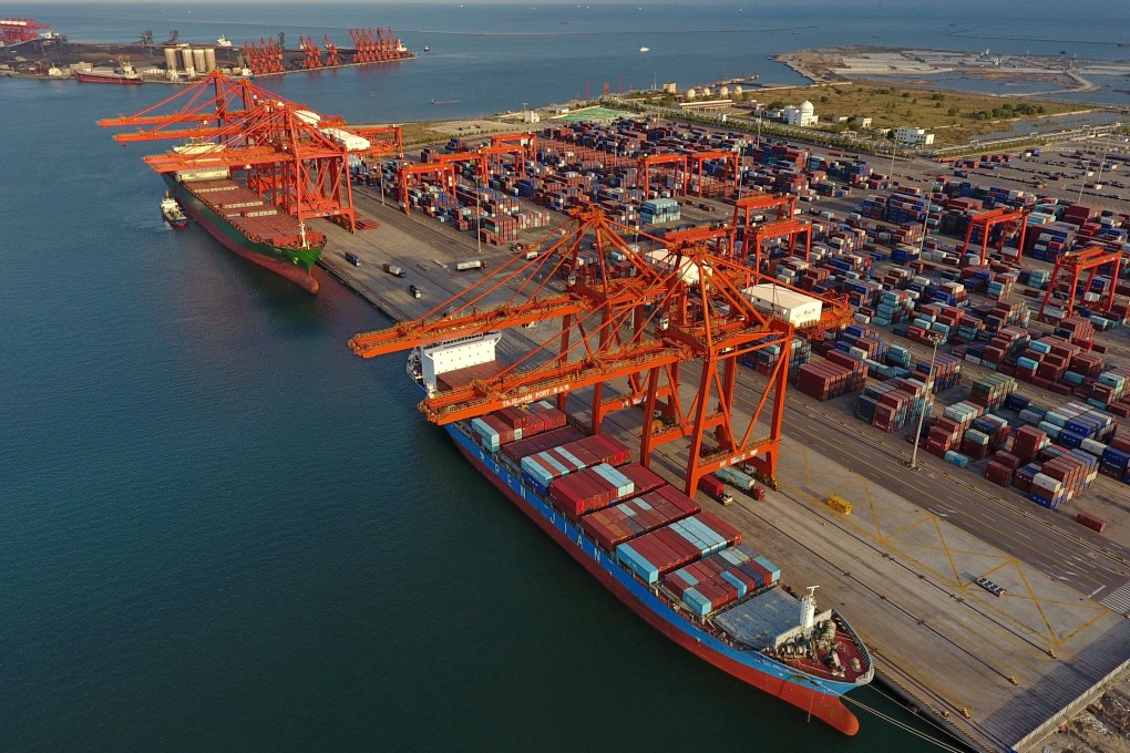 Two cargo ships loaded with containers are seen at the Jingtang port area in Hebei. Around 55 ships, along with scores of sailors, are still stuck in Chinese waters. Photo: Xinhua