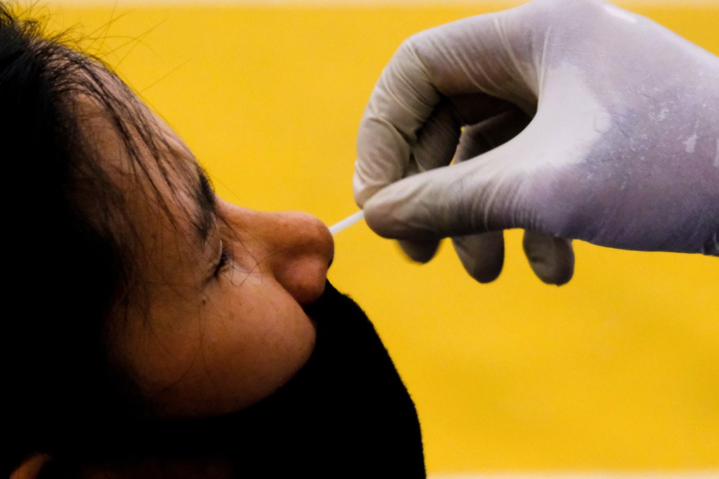 A health worker collects a nasal swab at a temporary Covid-19 testing centre in Petaling Jaya, Malaysia, on Tuesday. Photo: Bloomberg