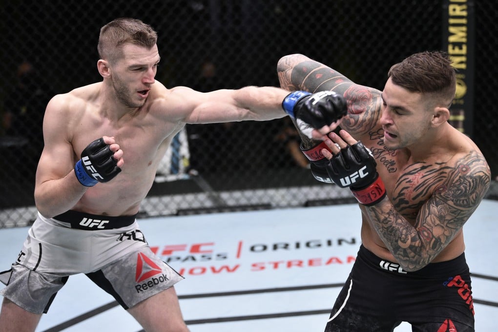 Dan Hooker punches Dustin Poirier during UFC Fight Night at the UFC Apex. Photo: Chris Unger/Zuffa LLC via USA TODAY Sports