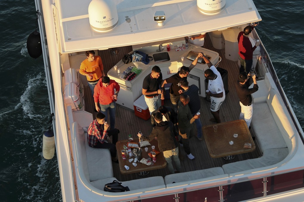 Tourists party on a yacht in Dubai, United Arab Emirates, earlier this month. Photo: AP