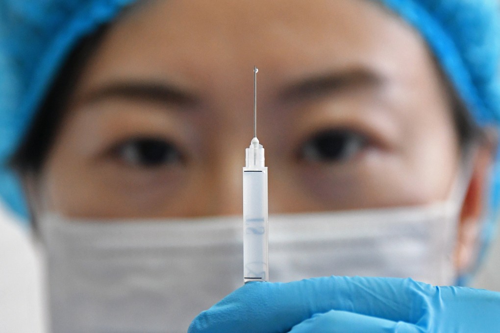 A medical worker prepares a shot of the Sinovac vaccine against Covid-19 at a community health station in Yantai, eastern Shandong province, on January 5. China plans to immunise 50 million people in certain high-risk groups before the Lunar New Year holiday in February, according to reports. Photo: EPA