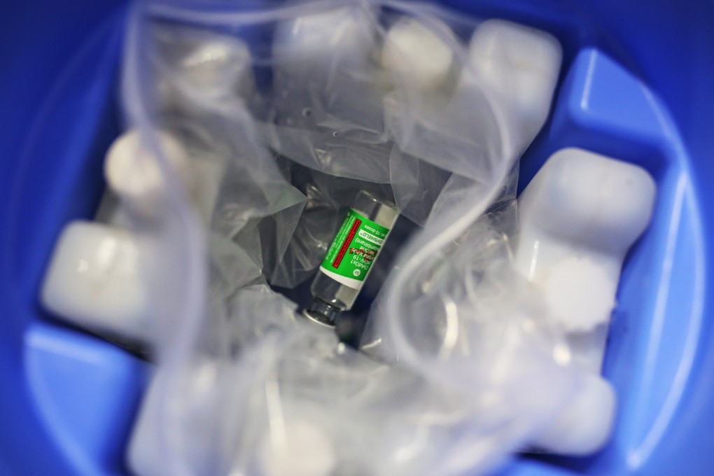 A vial of the Covishield vaccine, developed by Oxford/AstraZeneca and manufactured by Serum Institute of India, is seen in a cool box at a vaccine centre in Mumbai. The country will export millions of doses of the vaccine to its neighbours. Photo: Bloomberg