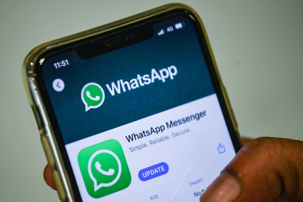 (FILES) In this file photo taken on November 6, 2020 a user updates Facebook's WhatsApp application on his mobile phone in Mumbai. Photo: AFP
