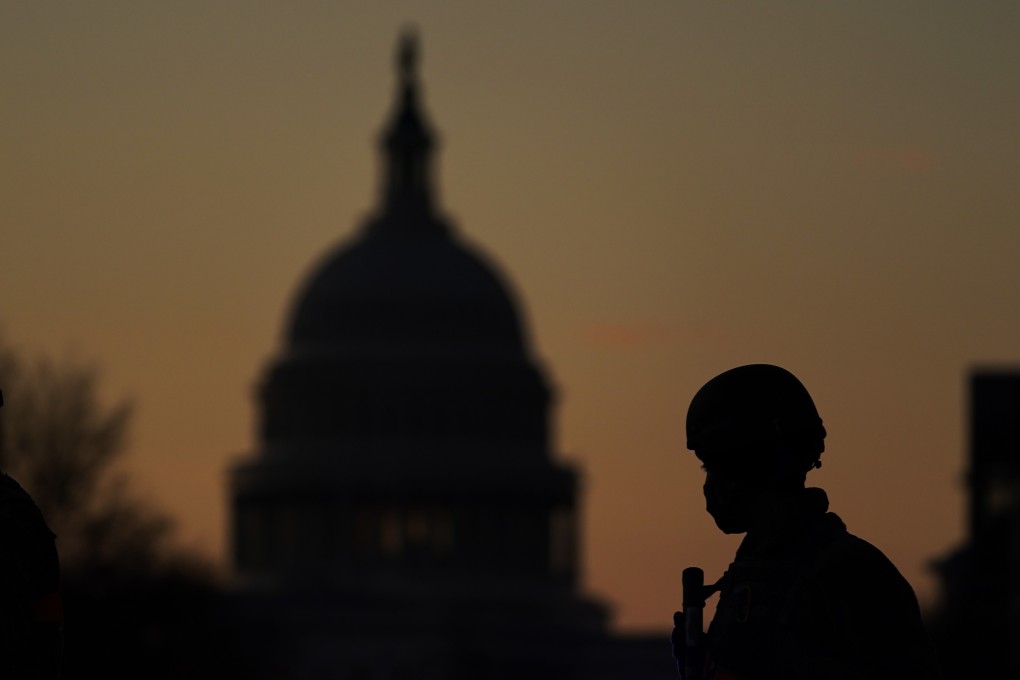 One of 25,000 National Guard troops on patrol in Washington ahead of Joe Biden's inauguration ceremony, in response to fears of further violence after the January 6 attack on the Capitol. Photo: AP