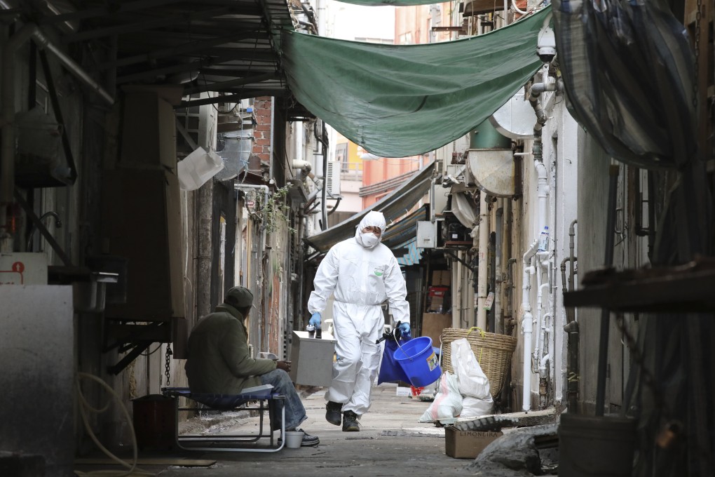 Laboratory workers collect sewage samples in an area of Jordan area affected by an outbreak of coronavirus infections. Photo: Nora Tam