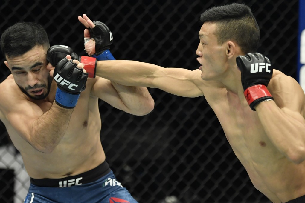 Su Mudaerji punches Zarrukh Adashev in a flyweight fight at the UFC Fight Night event at Etihad Arena in Abu Dhabi. Photos: Jeff Bottari/Zuffa LLC
