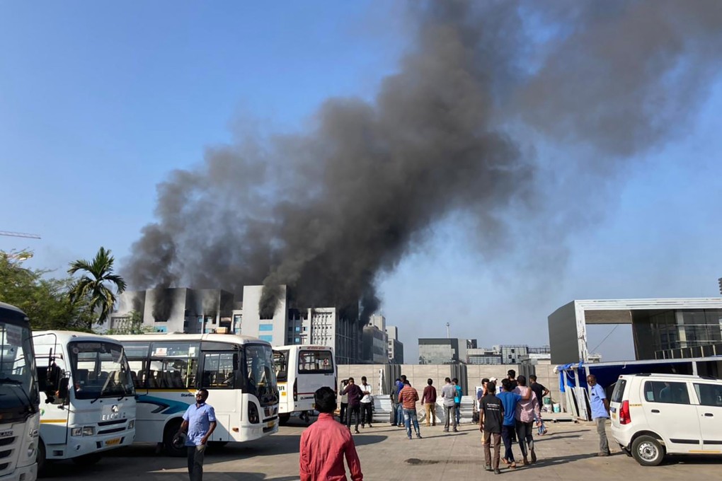 Smoke rises from the Serum Institute of India, the world‘s largest vaccine maker that is manufacturing the AstraZeneca/Oxford University vaccine for the coronavirus, in Pune on Thursday. Photo: AP