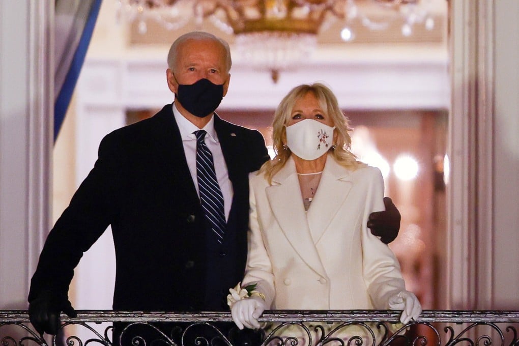 US President Joe Biden and first lady Jill Biden watch fireworks from the White House after his inauguration. Photo: Reuters