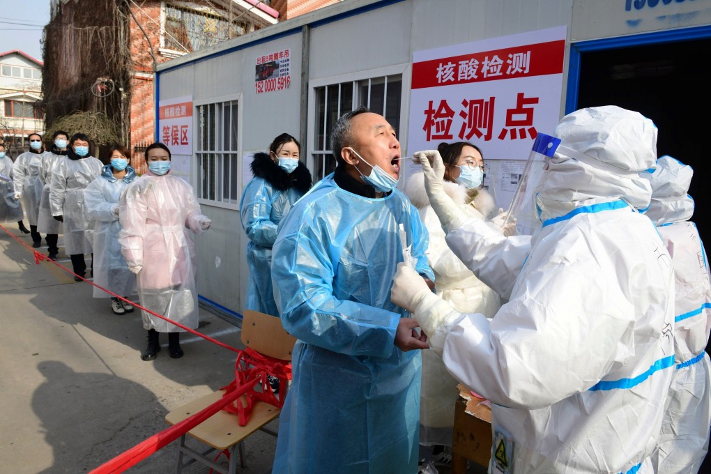Residents receive coronavirus tests at a residential compound in Shijiazhuang, Hebei province, as part of a mass testing programme after the province declared an “emergency state” this month. Photo: AFP