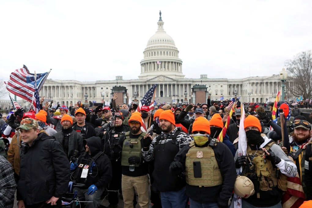 Members of the far-right group Proud Boys gather in front of the US Capitol in Washington, DC on January 6. Photo: Reuters