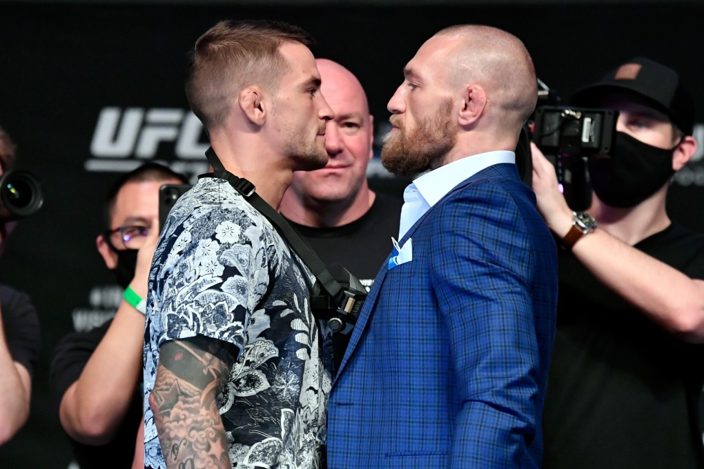 Dustin Poirier (left) and Conor McGregor face off during the UFC 257 press conference. Photos: Jeff Bottari/Zuffa LLC via Getty Images