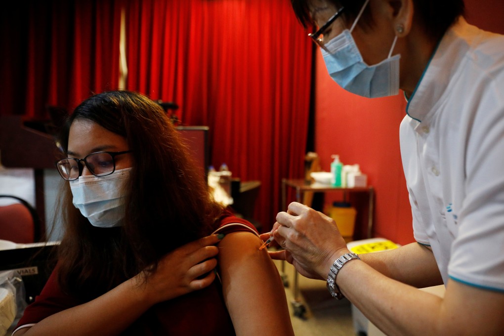 A health care worker is vaccinated at Gleneagles Hospital in Singapore on January 19, 2021. Photo: Reuters