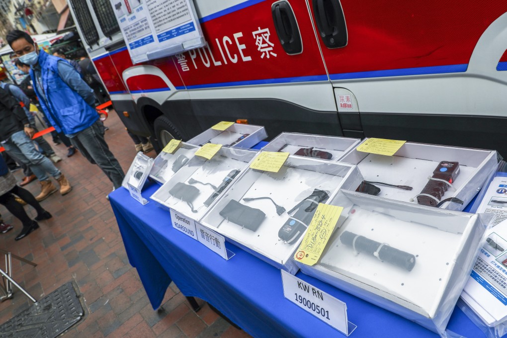 Police display some of the stun guns seized during a press briefing in Sham Shui Po. Photo: Nora Tam