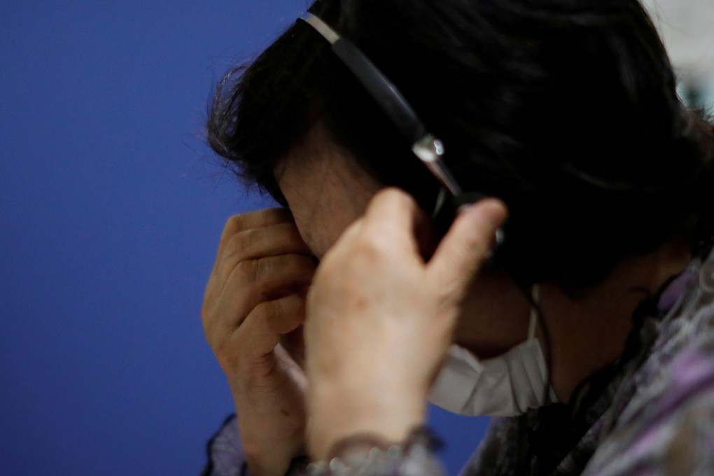 A volunteer responds an incoming call at the Tokyo Befrienders call centre, a Tokyo suicide hotline. Photo: Reuters