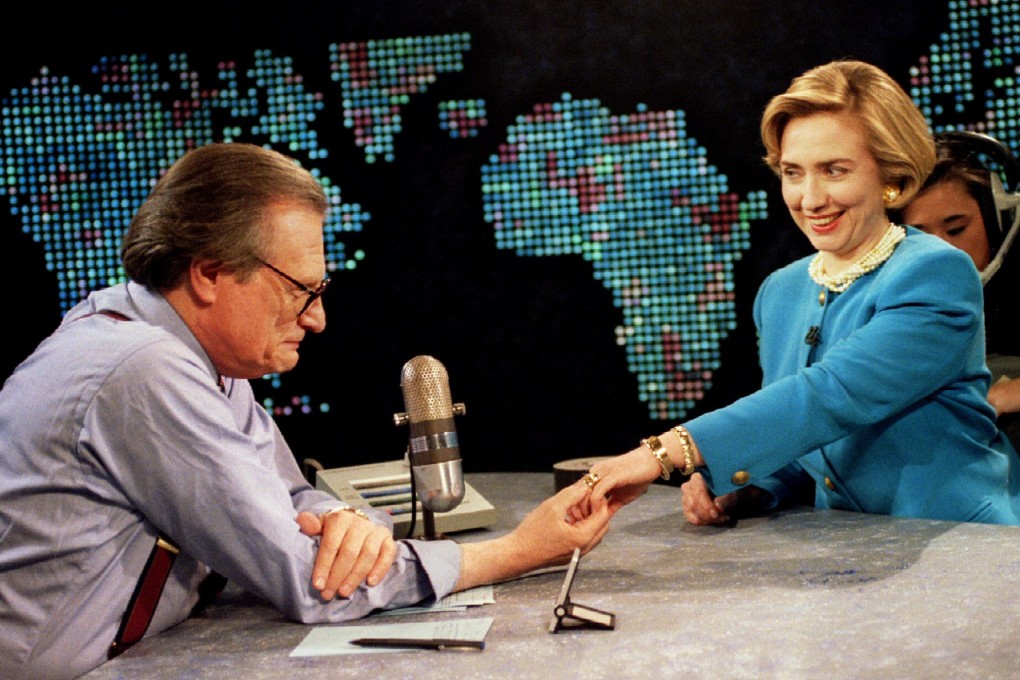 Sporting a new hairdo, first lady Hillary Clinton shows her wedding ring to Larry King in 1994 in Washington. File photo: Reuters