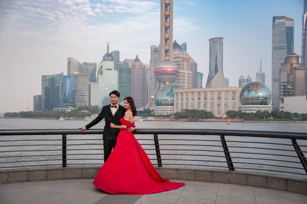 Young couple posing for pre-wedding photos on the Shanghai Bund. Photo: Shutterstock Images