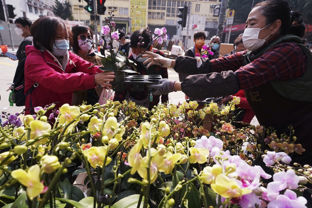 People in Prince Edward buy festive flowers for Lunar New Year. Photo: Felix Wong