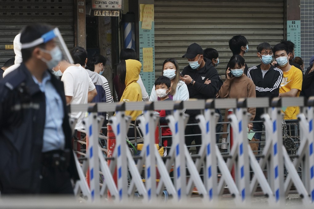 Residents queue up for mandatory testing in a locked down area of Jordan. Photo: Felix Wong