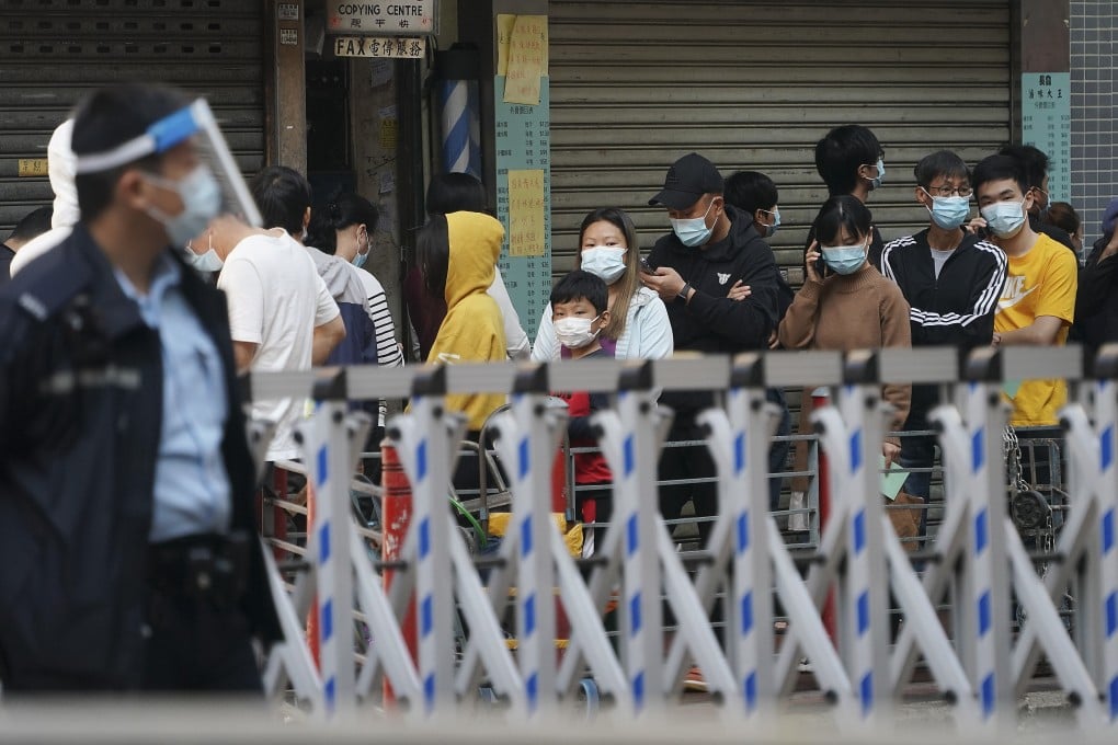 Residents queue up for mandatory testing in a locked down area of Jordan. Photo: Felix Wong