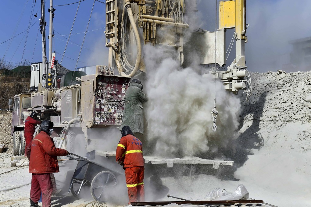 Rescuers drill a channel at the mine site on Tuesday. The workers have been trapped underground since January 10. Photo: Xinhua