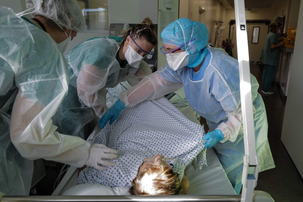 Nurses care for a Covid-19 patient inside a hospital’s resuscitation unit in Colmar, eastern France. Photo: SFP