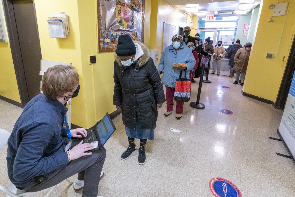 A screener registers residents of the William Reid Apartments at a COVID-19 pop-up vaccination site at in New York. Photo: AP