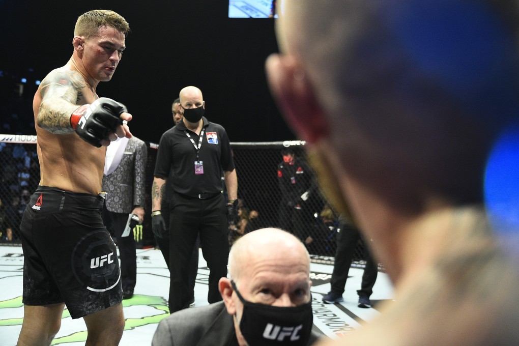 Dustin Poirier gestures to Conor McGregor after his victory in their lightweight fight at UFC 257 in Abu Dhabi. Photo: Chris Unger/Zuffa LLC