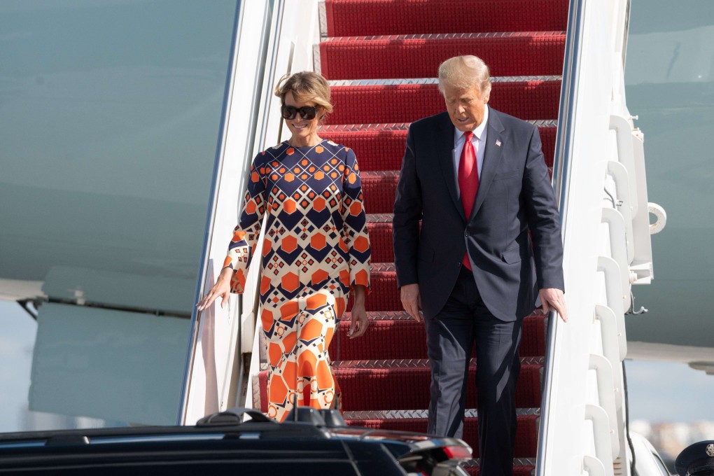 Melania Trump smiles as she descends from Air Force One in Florida with her husband, outgoing US president Donald Trump, on January 20. Mid-air, she swapped a sober, all-black outfit for a boho-chic Gucci kaftan dress, typical of her preference for high-end European fashion. Photo: Noam Galai/Getty Images/AFP