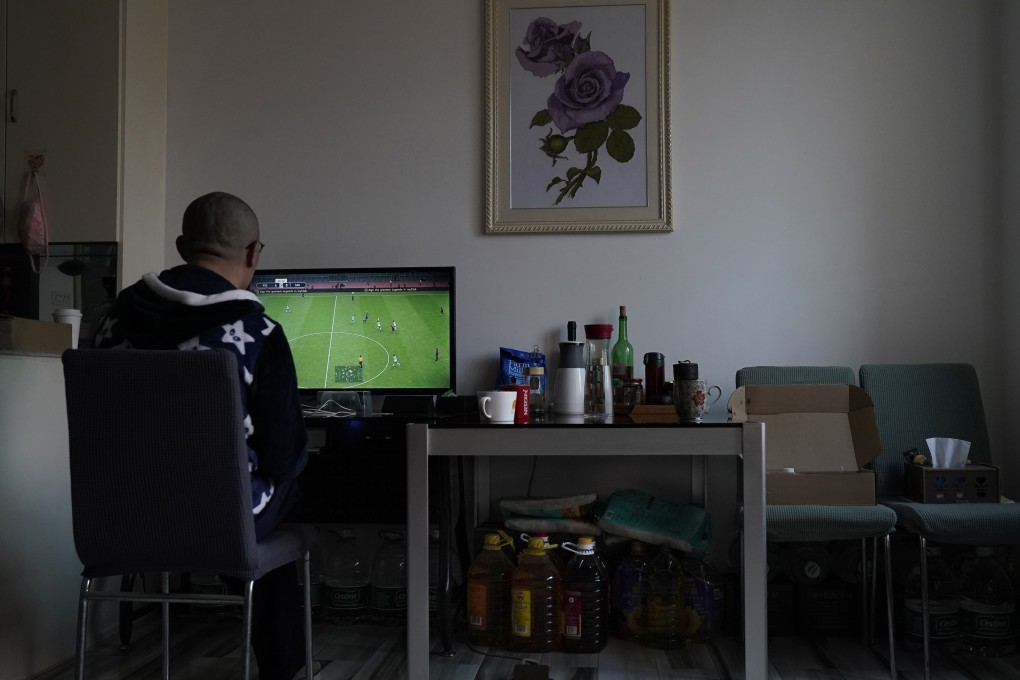 Zhu Tao plays virtual soccer at his home in Wuhan. After the lockdown was lifted, Zhu asked for a year’s medical leave and shut himself in. Photo: AP