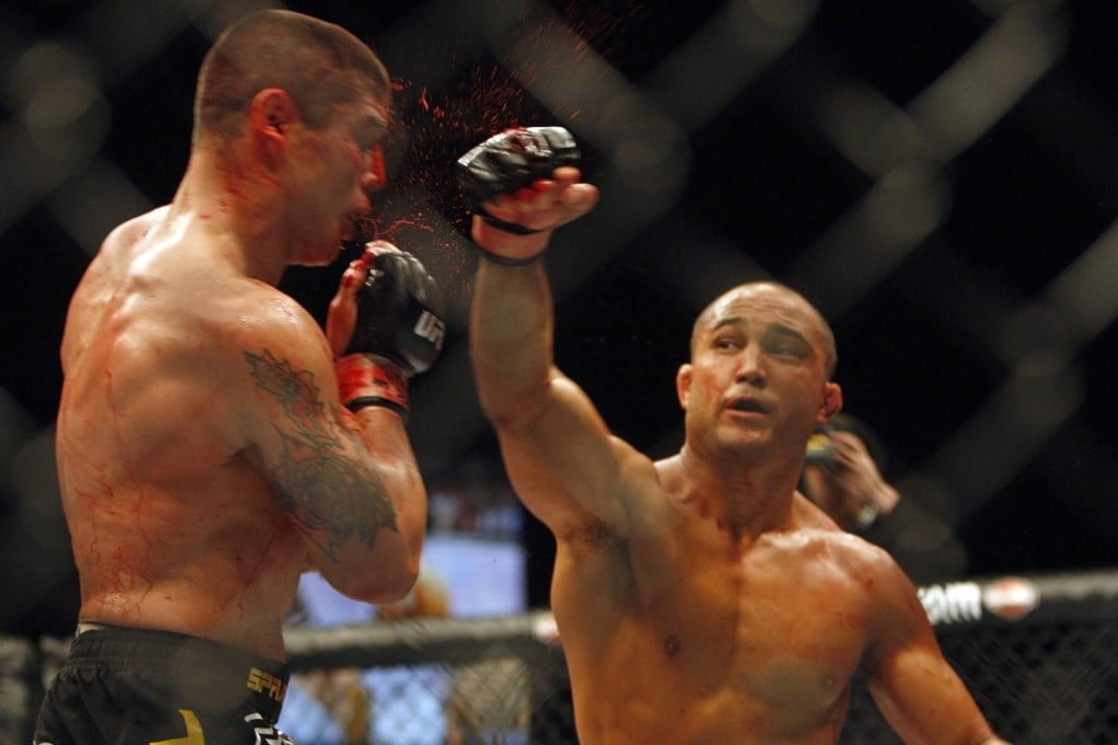 BJ Penn punches a bloody Joe Stevenson in their lightweight title bout at UFC 80 at the Metro Radio Arena in Newcastle, England in 2008. Photo: AP