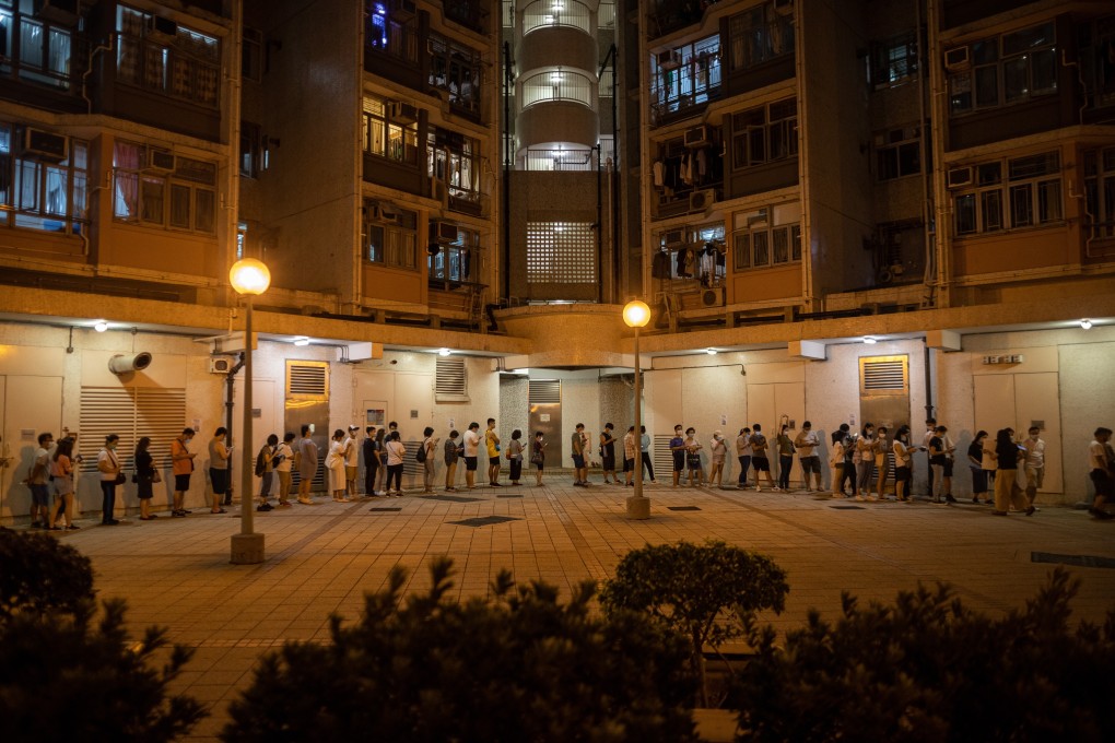 Voters wait in line during the “35-plus” primaries on July 11, 2020, held to select pro-democrat candidates for the since postponed Legislative Council elections in Hong Kong. Photo: EPA-EFE