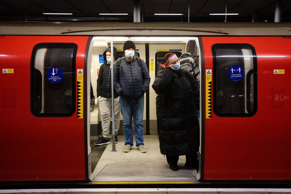 Commuters in a Jubilee line tube train at Canning Town Station in London. Photo: Bloomberg