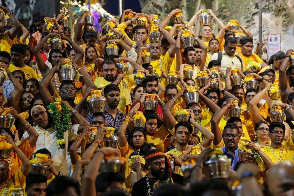 Hindu devotees carry milk pots on their heads as they gather at a shrine in Batu Caves during the 2019 Thaipusam celebrations in Kuala Lumpur. Photo: Reuters