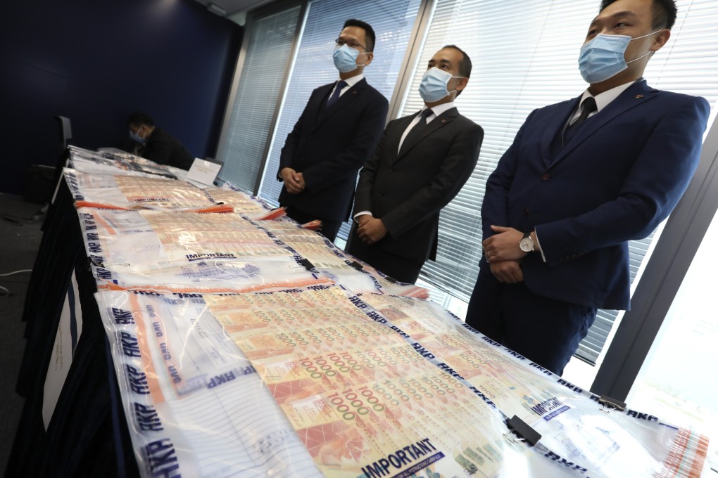 Members of the Hong Kong police force’s fraud division hold a press conference on money laundering at Police Headquarters on January 20. Photo: Nora Tam