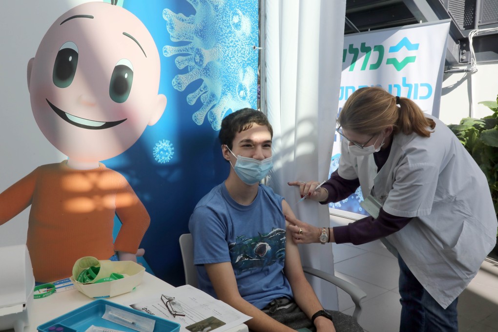 An Israeli teenager receives a dose of Covid-19 vaccine at a health centre in Tel Aviv on January 23. Israel began vaccinating on December 19, reaching 10 per cent of its population by the end of 2020. Photo: Xinhua