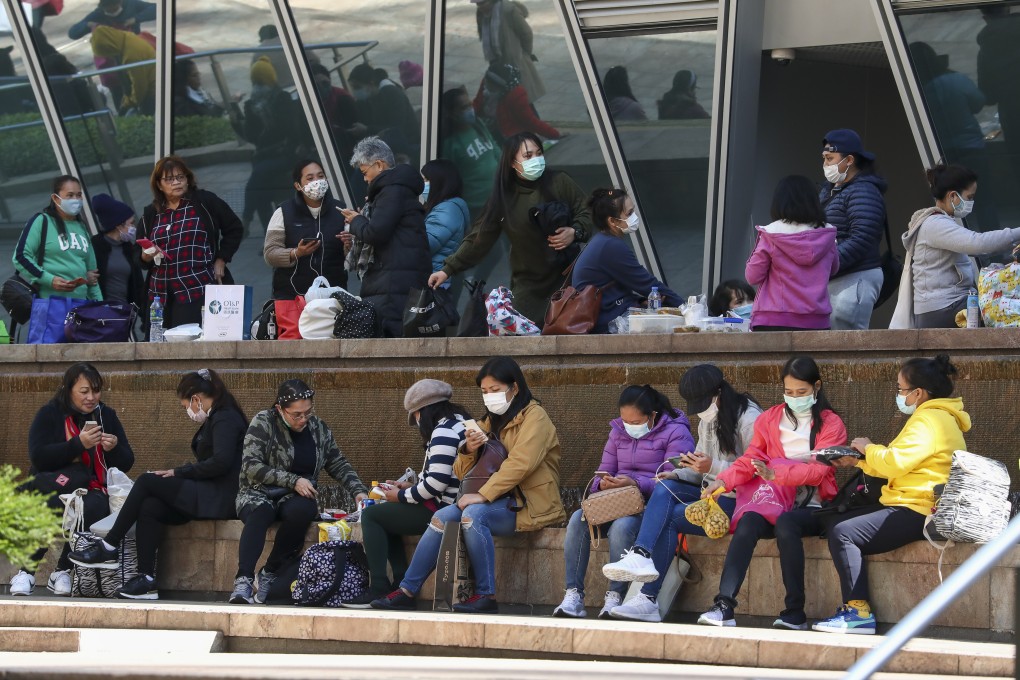 Domestic helpers enjoy their day off in Central. Photo: Jonathan Wong