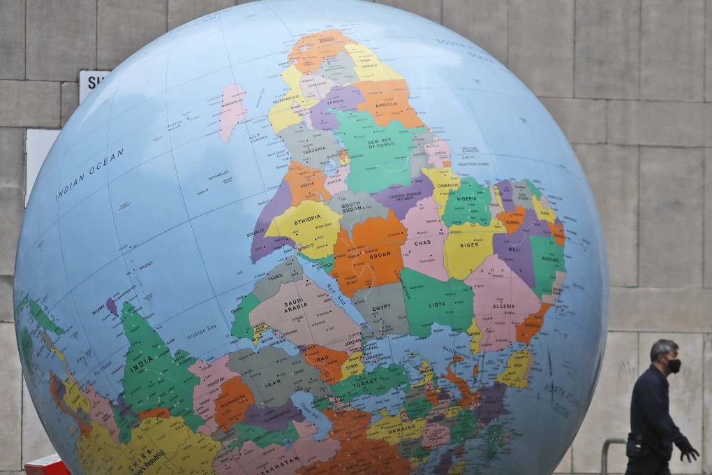 A giant globe in front of the London School of Economics. The pandemic has claimed some 2.2 million lives worldwide. Photo: AP