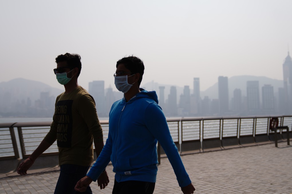 Hong Kong Island is shrouded in pollution and smog, as seen from the Tsim Sha Tsui promenade across Victoria Harbour on January 17. Photo: Sam Tsang